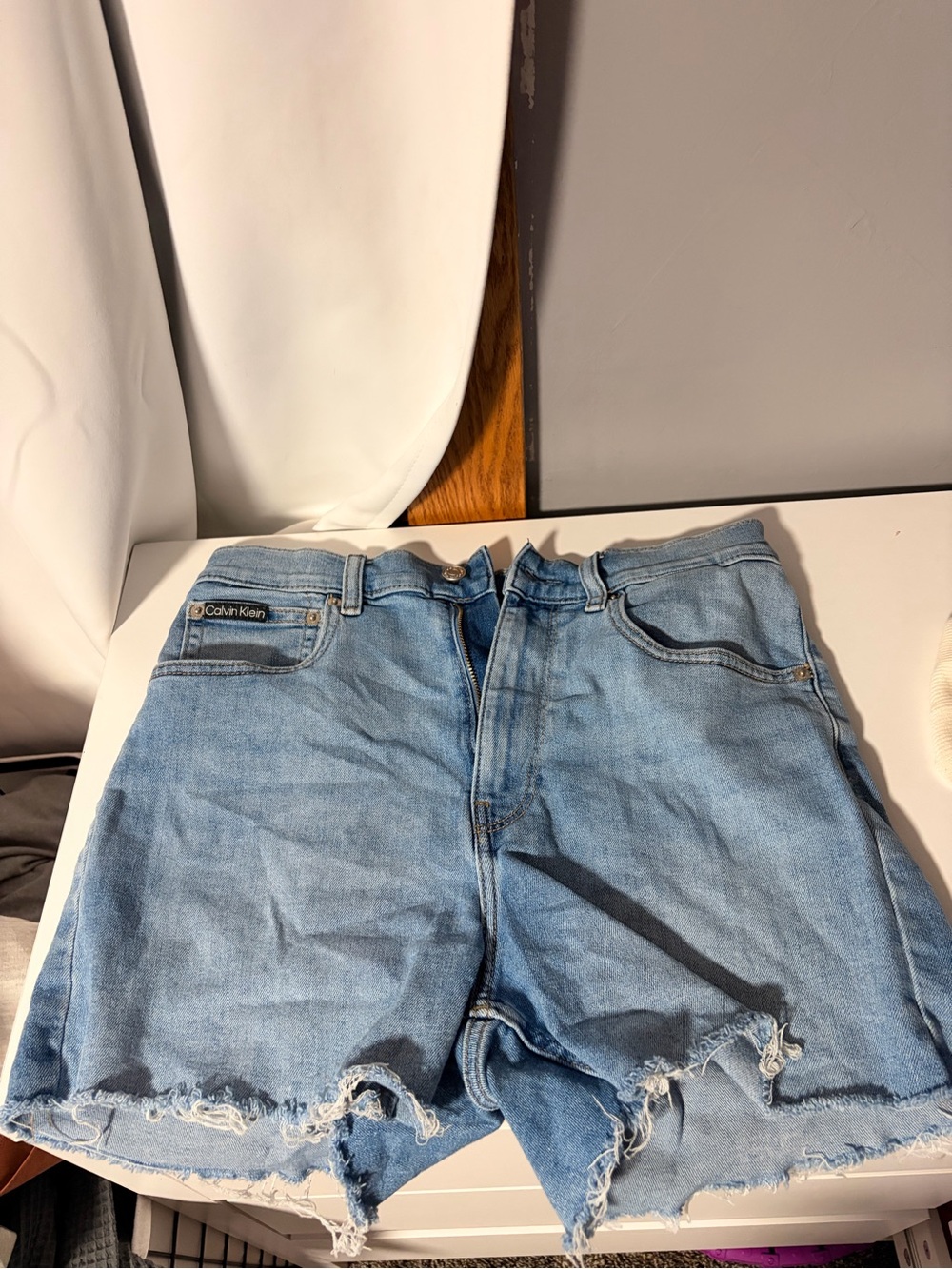 Calvin Klein Light Blue Distressed Denim Cutoff Shorts